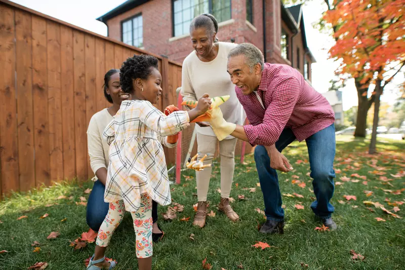 Grandparents engaging with their granddaughter, happily