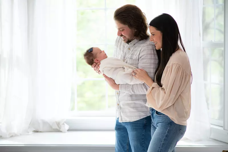 The Trapp family with their newborn daughter