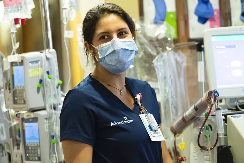 A nurse wearing a face mask at a facility. 