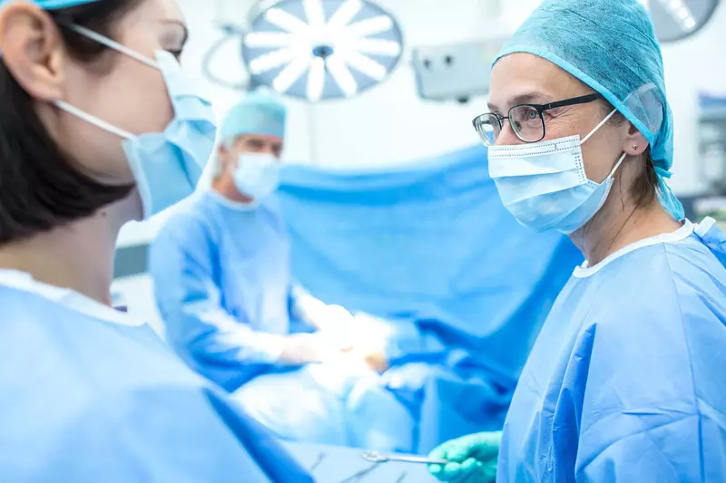 A surgical team talking while doing surgery