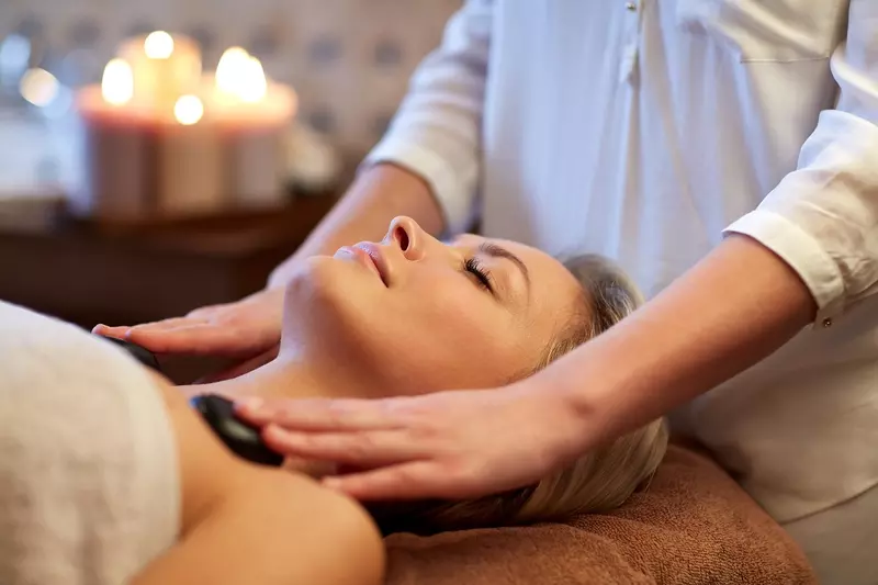 Patient receiving a hot stone massage