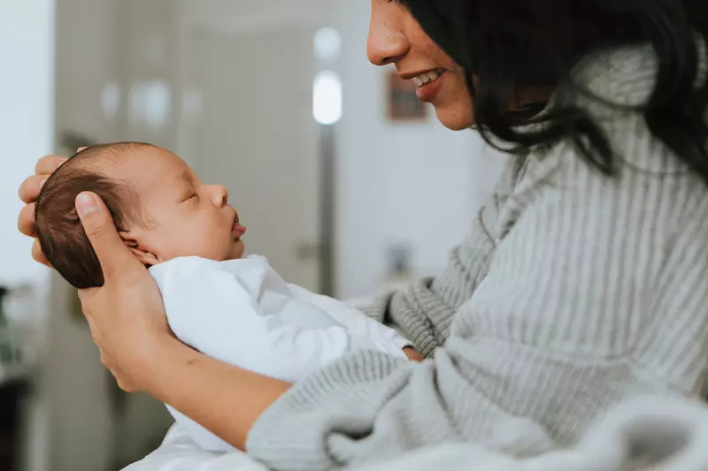 Mom holding infant