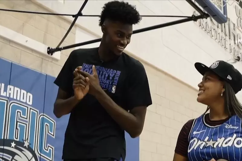 Jonathan Isaac of the Orlando Magic with a fan.