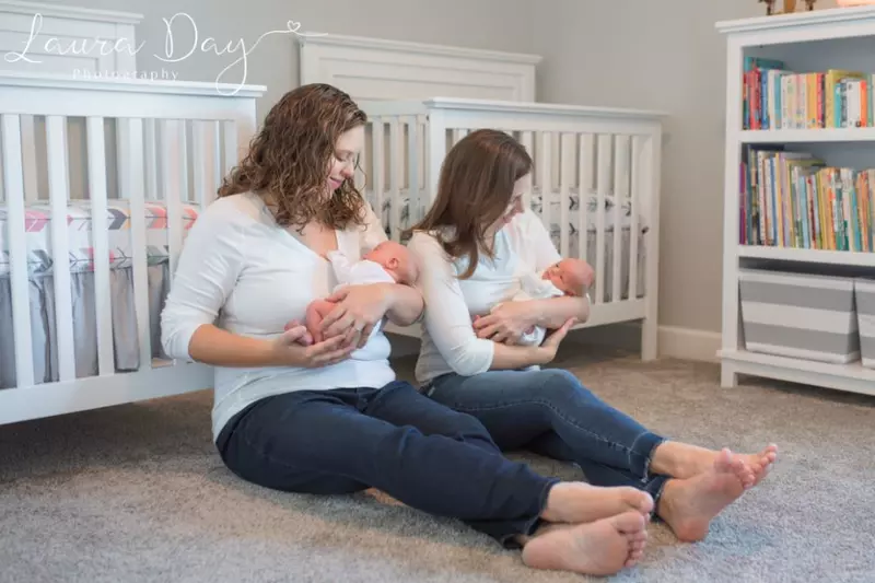 Meagan C and her wife holding her babies