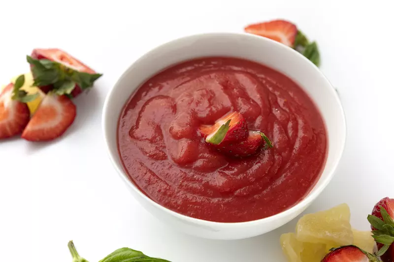 Bowl of strawberry sauce topping