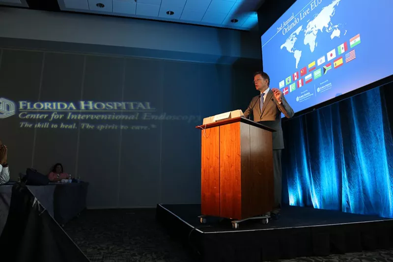 Speaker talking at a conference at a Nicholson Center Education Center room.