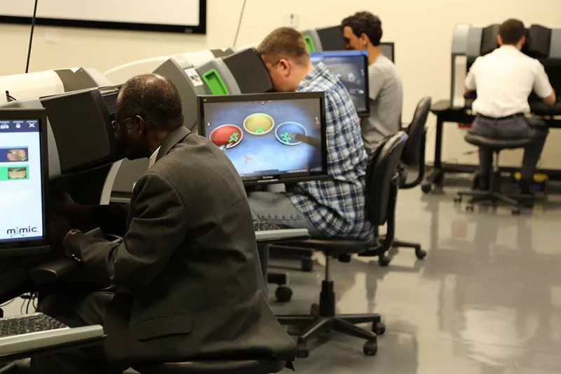 Professionals in a simulation in the Nicholson Center Simulation Lab.