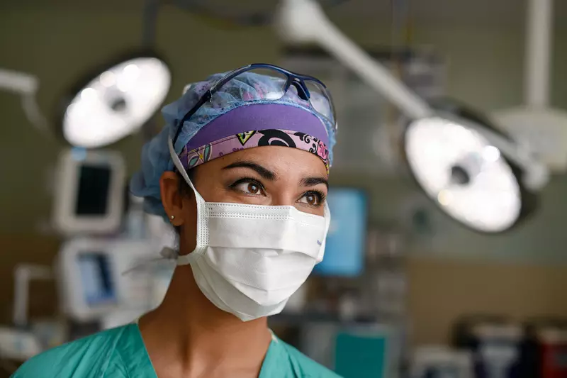 A nurse focusing her attention in the operating room