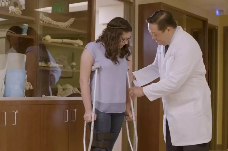 A Doctor Helps a Patient Adjust Her New Crutches