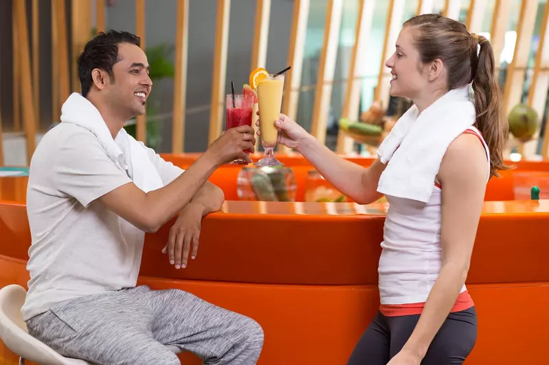 Gym customers holding smoothies