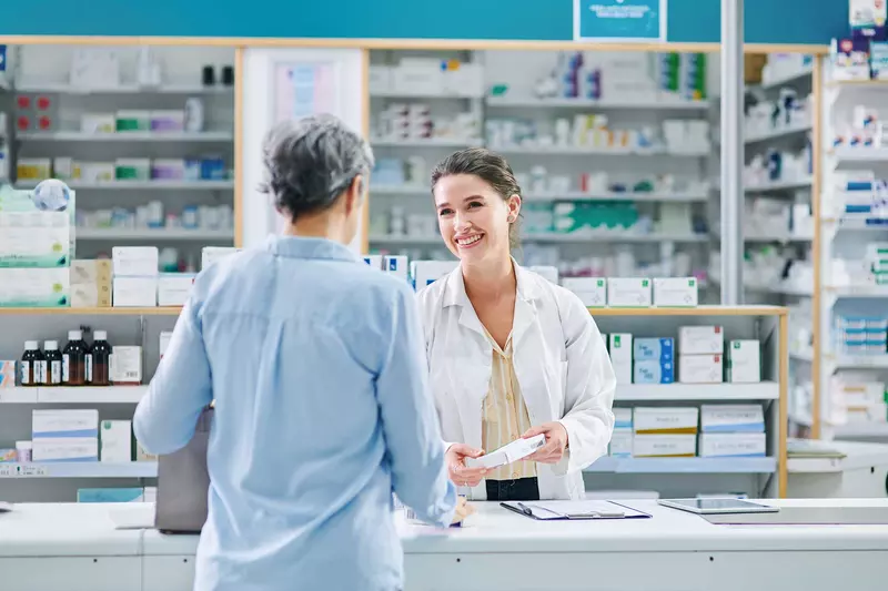 A pharmacist talking with a customer