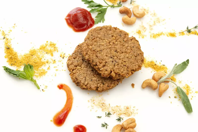 Two homemade cashew and oat-based patties