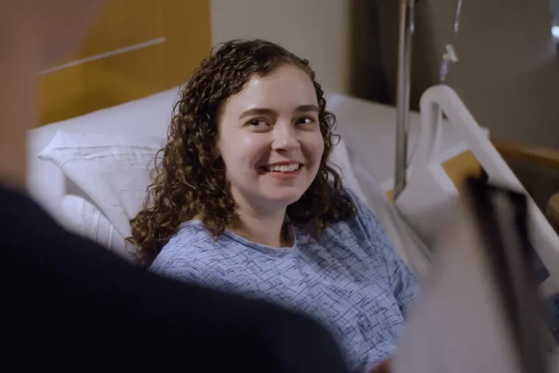 An AdventHealth Translational Research Institute Patient Smiles at an Off Camera Provider