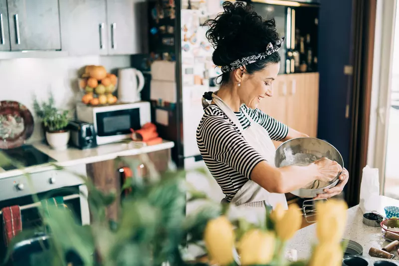 A woman cooking.