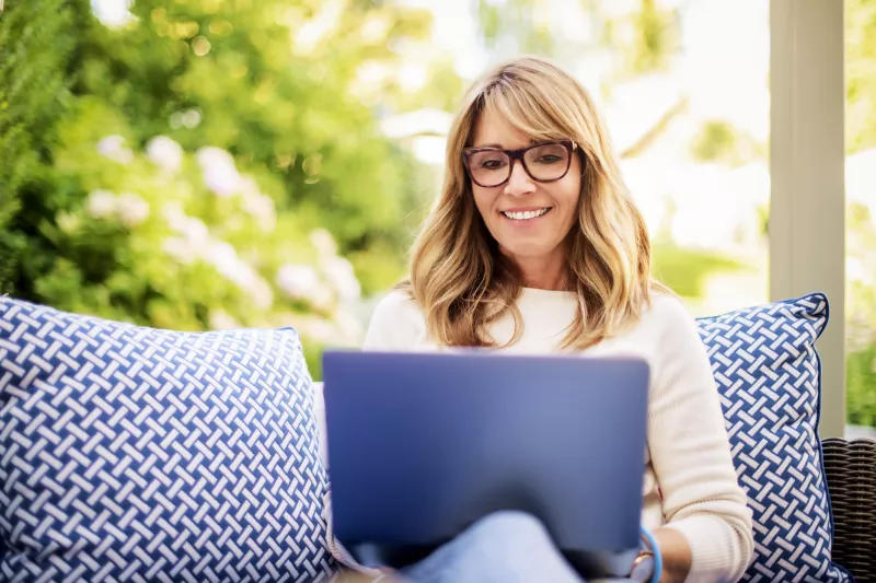 Woman using a laptop.