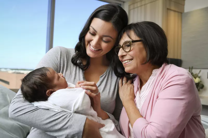 Mother and Grandmother holding a baby
