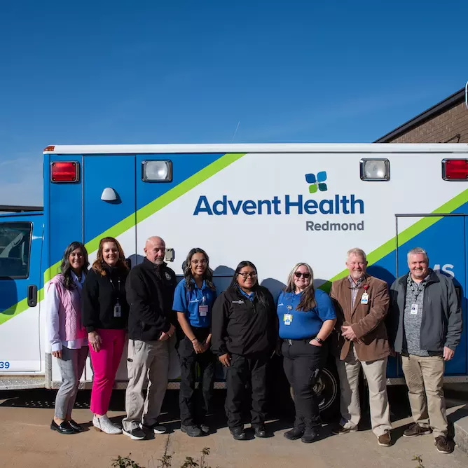 Faculty, superintendents and AdventHealth Redmond EMS gather to celebrate the new ambulance