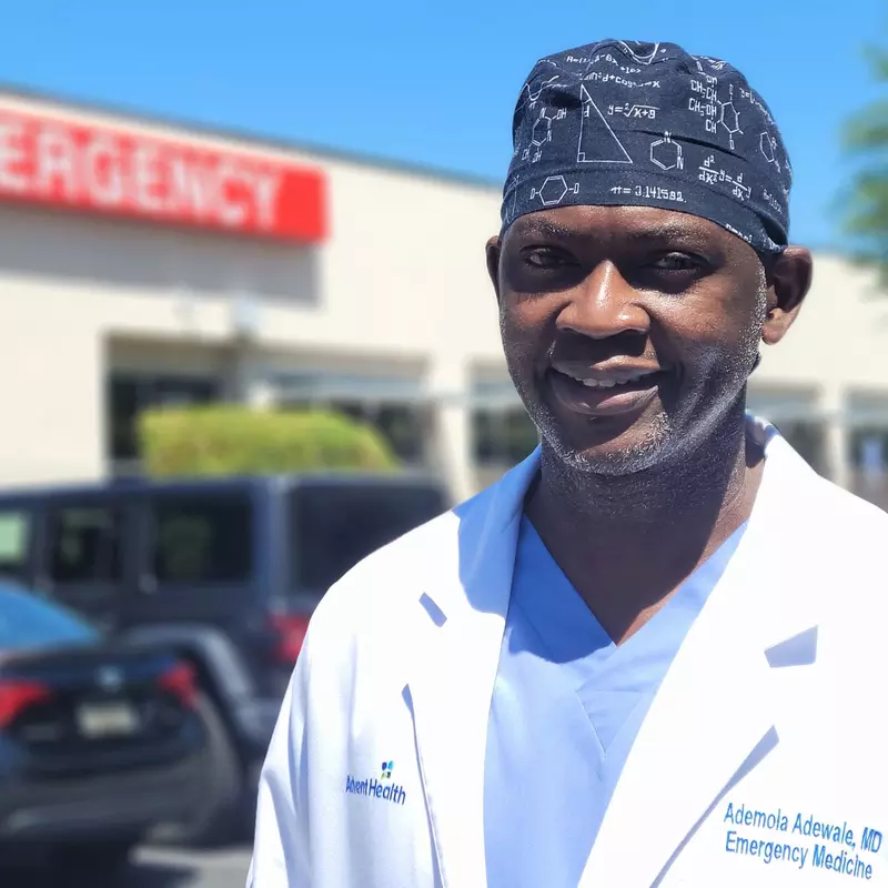 Ademola Adewale, MD in front of Emergency Department at East Orlando