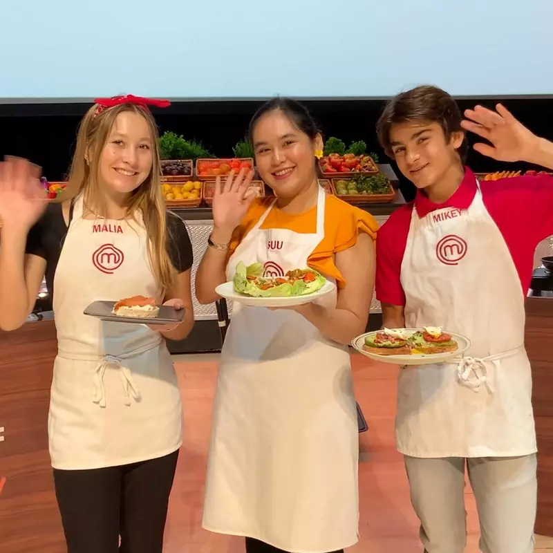 Three contestants with their dishes from the Master Chef competition