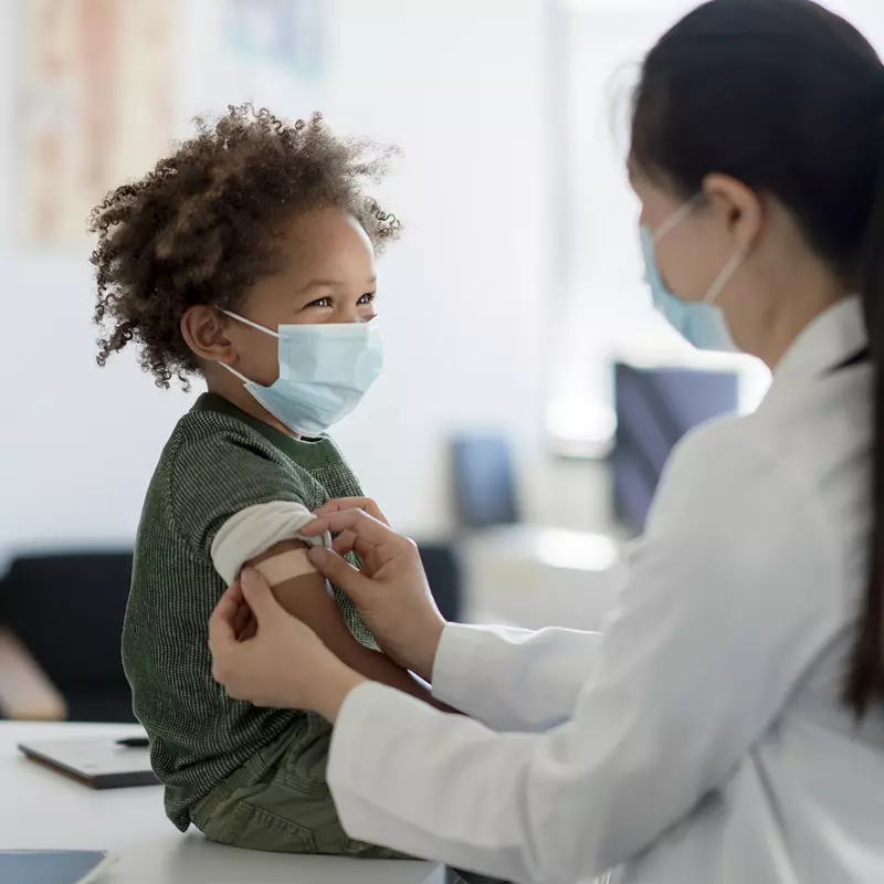 A Pediatrician Checks a Young Boy's Vitals in an Exam Room
