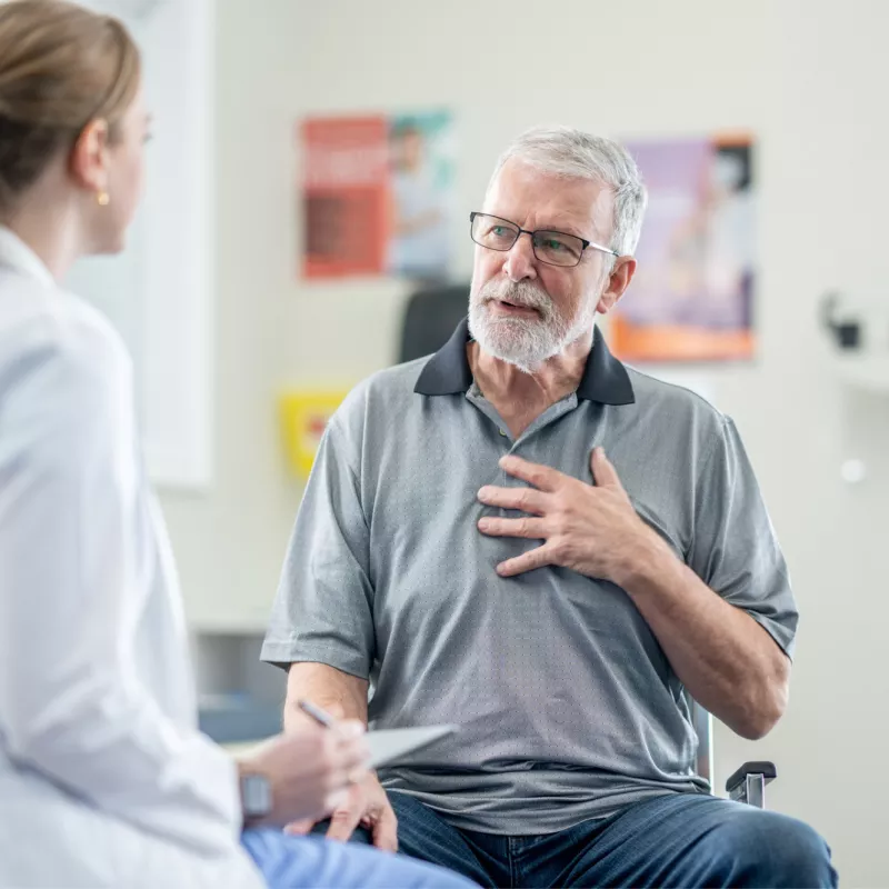 A Senior Patient Speaks to His Physician is an Exam Room