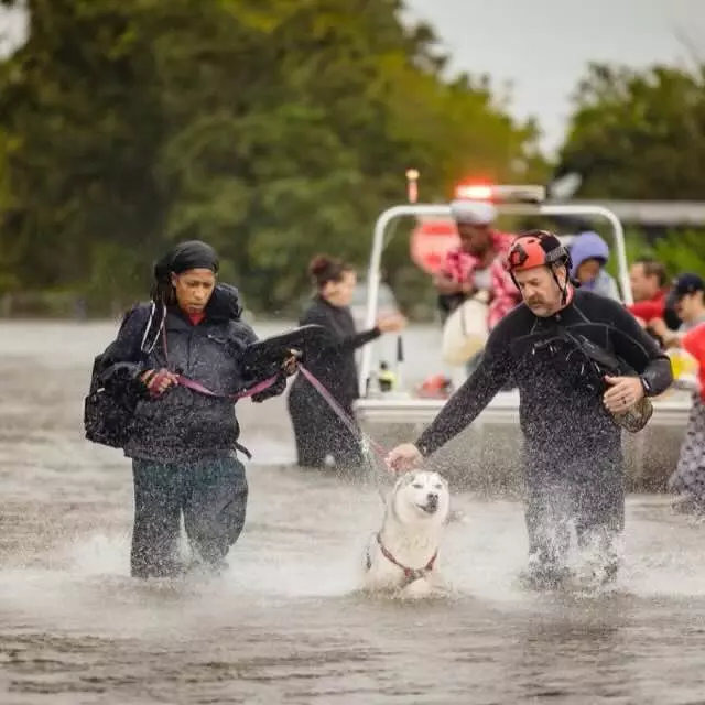 Firefighters rescuing people durring Hurricane Ian
