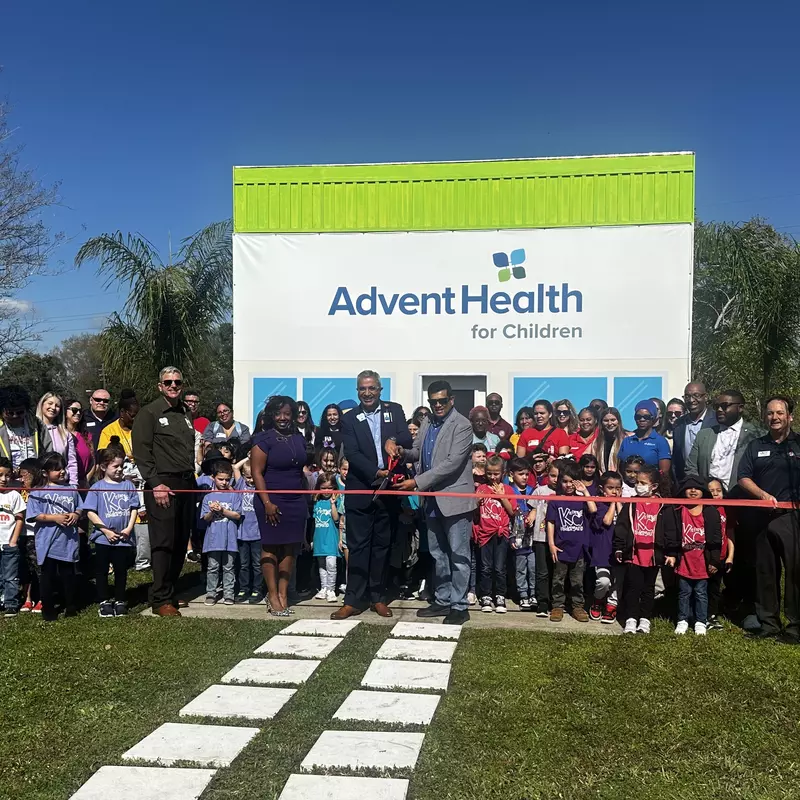 AdventHealth for Children and students from Arbor Ridge School cut the ribbon on a mini "hospital" in the Children's Safety Village.