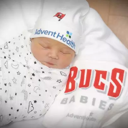 A 2021 newborn baby having clothes that show support for the Tampa Bay Buccaneers