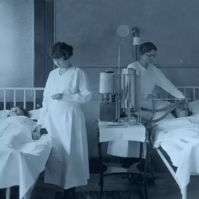 Two nurses treating patients