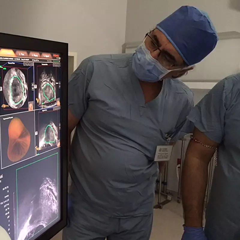 Global Robotics Doctors Looking at an MRI Fusion Machine