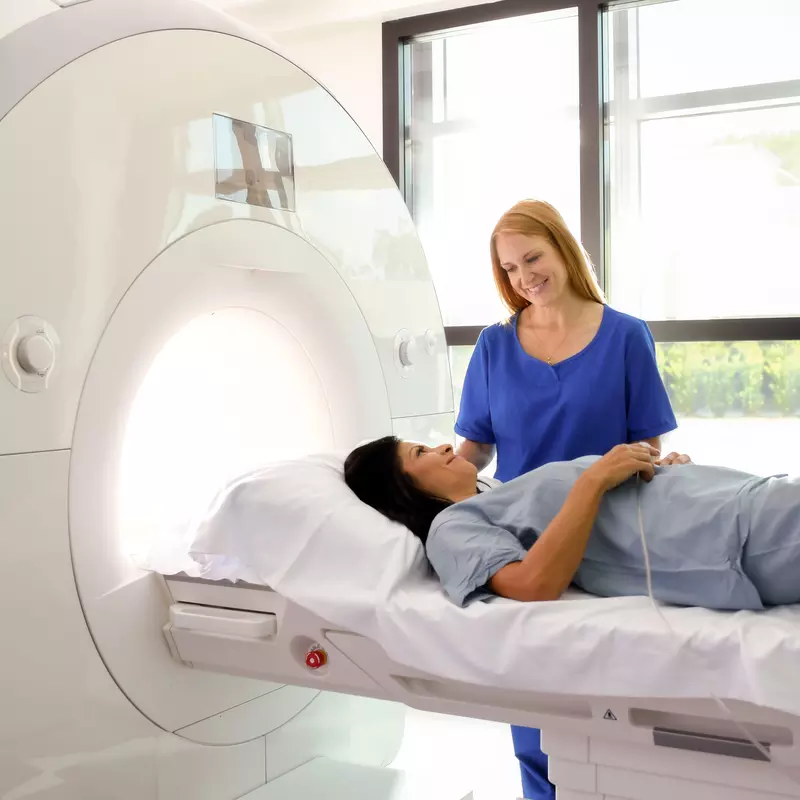 A woman prepares for an MRI.
