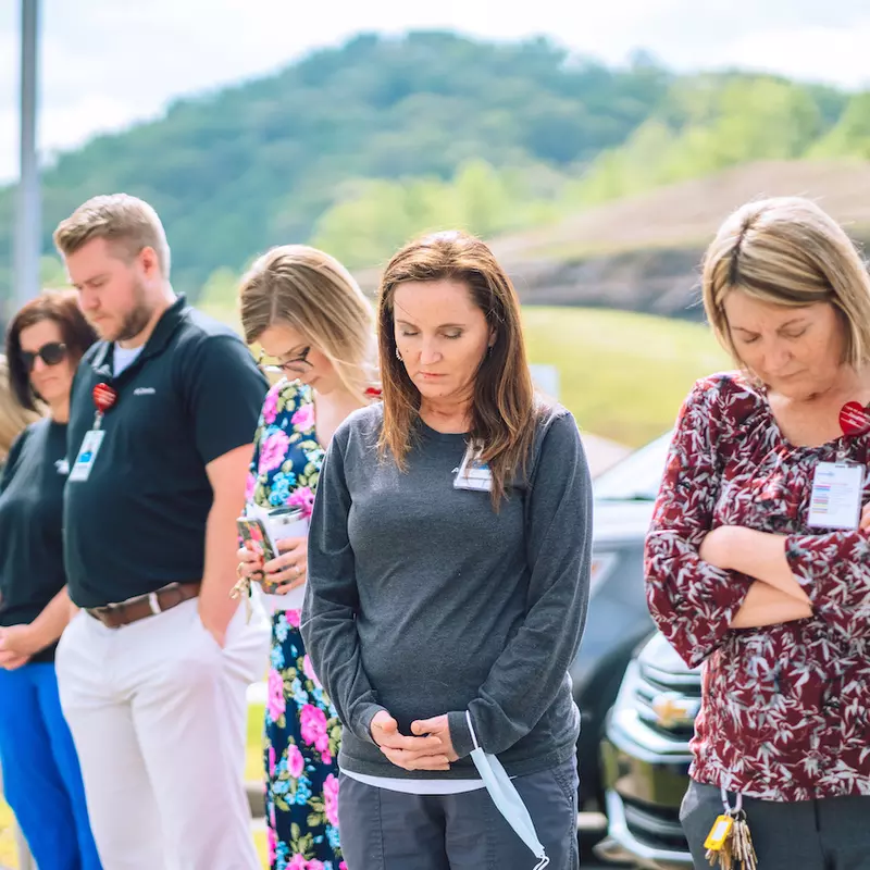 Team members at AdventHealth Manchester gather for National Day of Prayer.