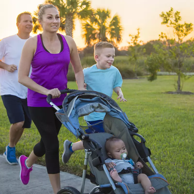 A family enjoys a run together.