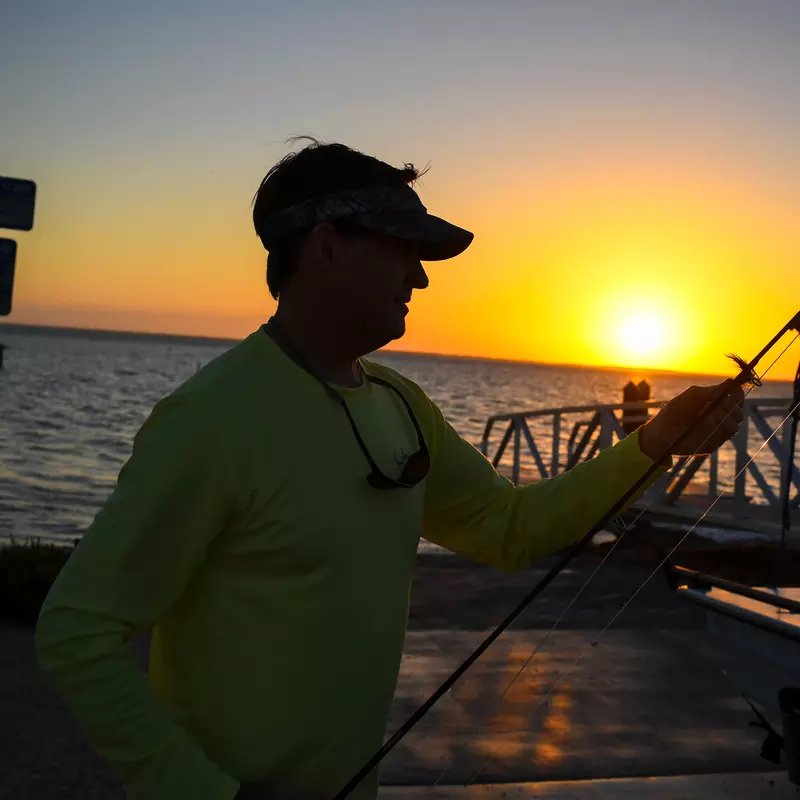 Man fishing during sunset,