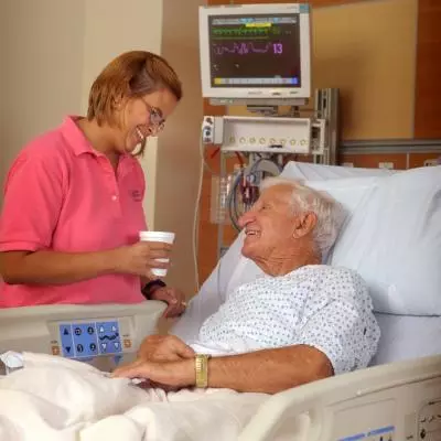 Volunteer talking with Elderly Patient