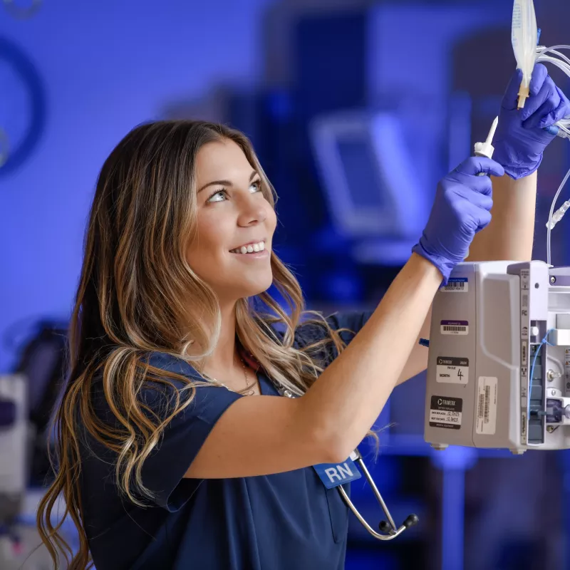 AdventHealth Nurse hanging IV bag