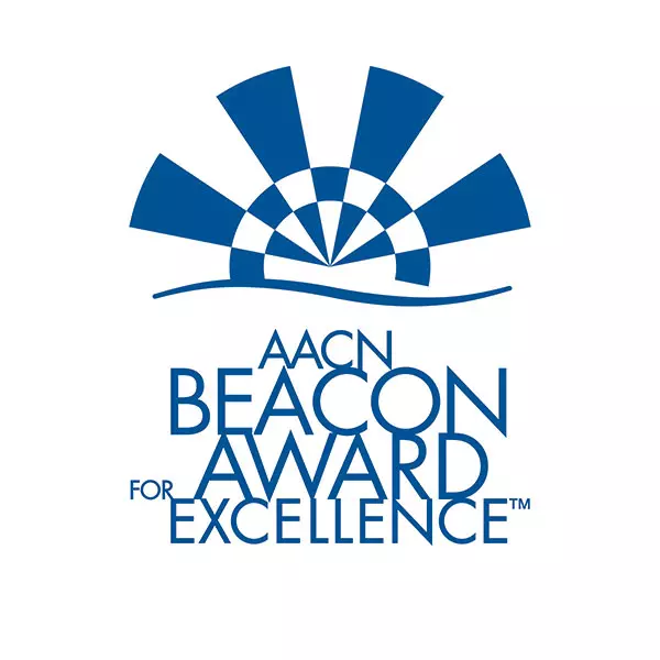 The logo for The American Association of Critical-Care Nurses (AACN) Beacon Award for Excellence