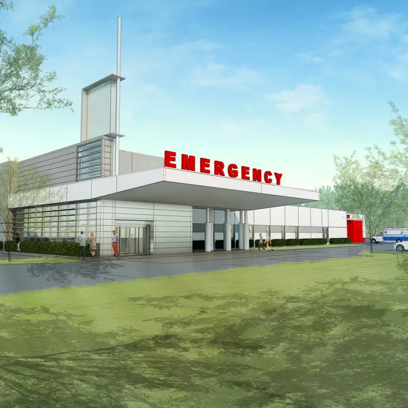 Drawn rendering of a Emergency Room building--white with red Emergency letters, surrounded by green space.