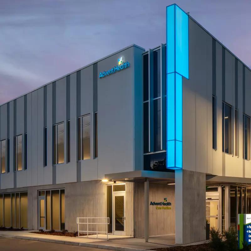 Outside of AdventHealth Care Pavilion Westchase at dusk.