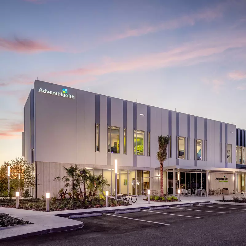 Exterior of AdventHealth Care Pavilion Central Pasco in the evening.