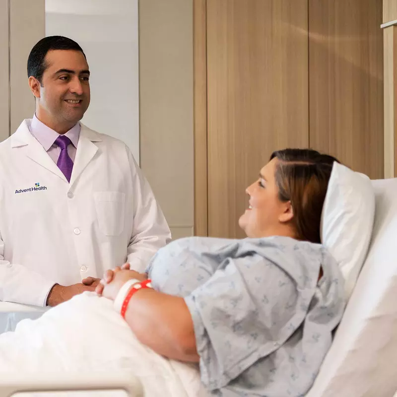 A bariatric doctor talking to his female patient.