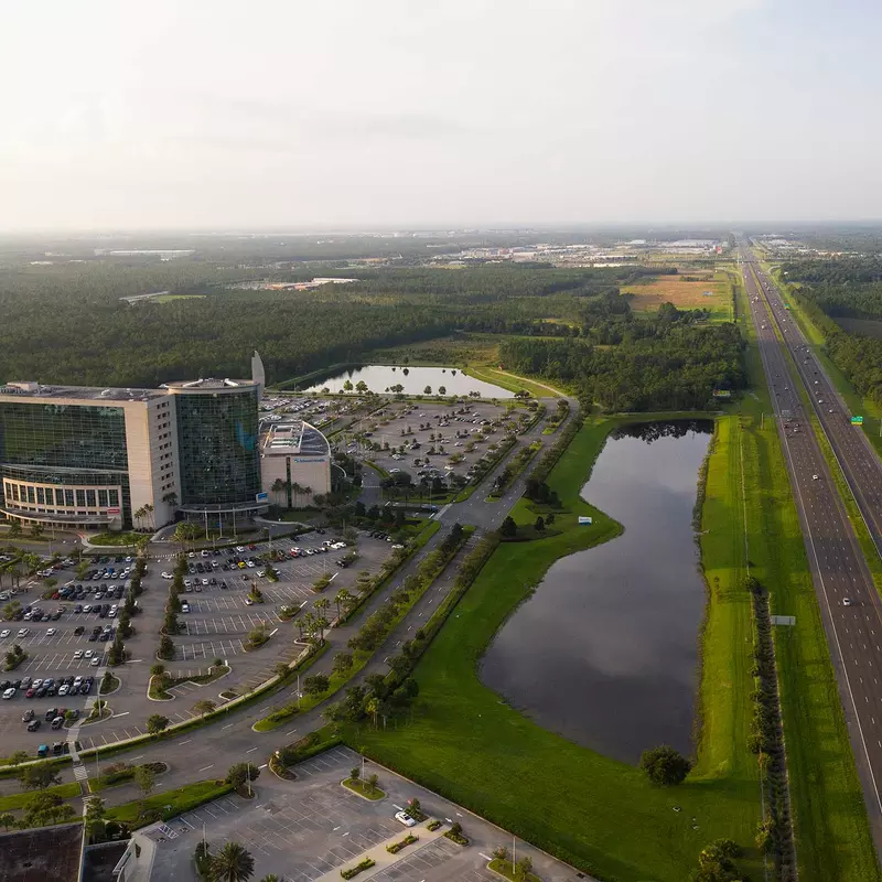 A bird's-eye view of the AdventHealth Daytona building and surrounding area.
