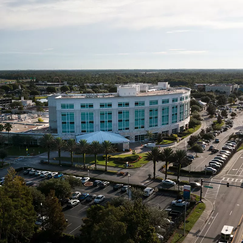 A bird's-eye view of the AdventHealth East Orlando building and surrounding area.