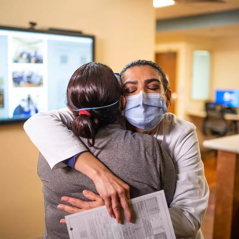 An AdventHealth physician hugging her patient