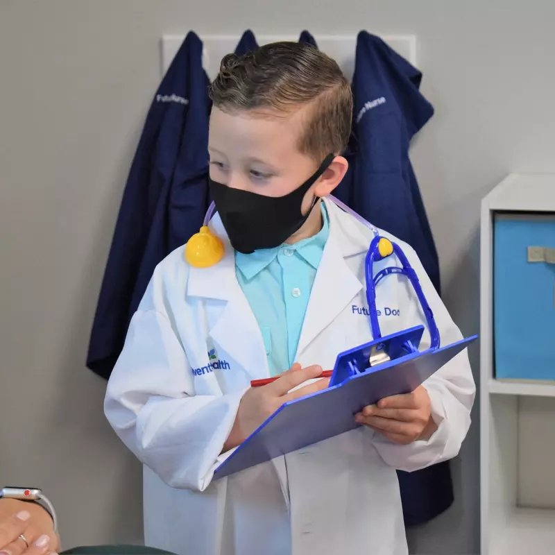 child pretending to be a doctor