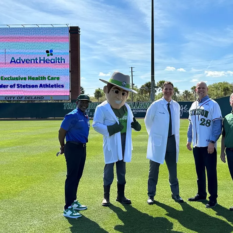 Stetson University President, Chrisopher F. Roellke, PhD and AdventHealth DeLand President and CEO, Eric Lunde are joined by Stetson Athletic Director, Jeff Altier, AdventHealth Athletic Trainer, Larry Bell and Stetson Mascot, John B to official announce an expansion of the two organization’s partnership as AdventHealth becomes the Official Health Care Provider of Stetson University Athletics.