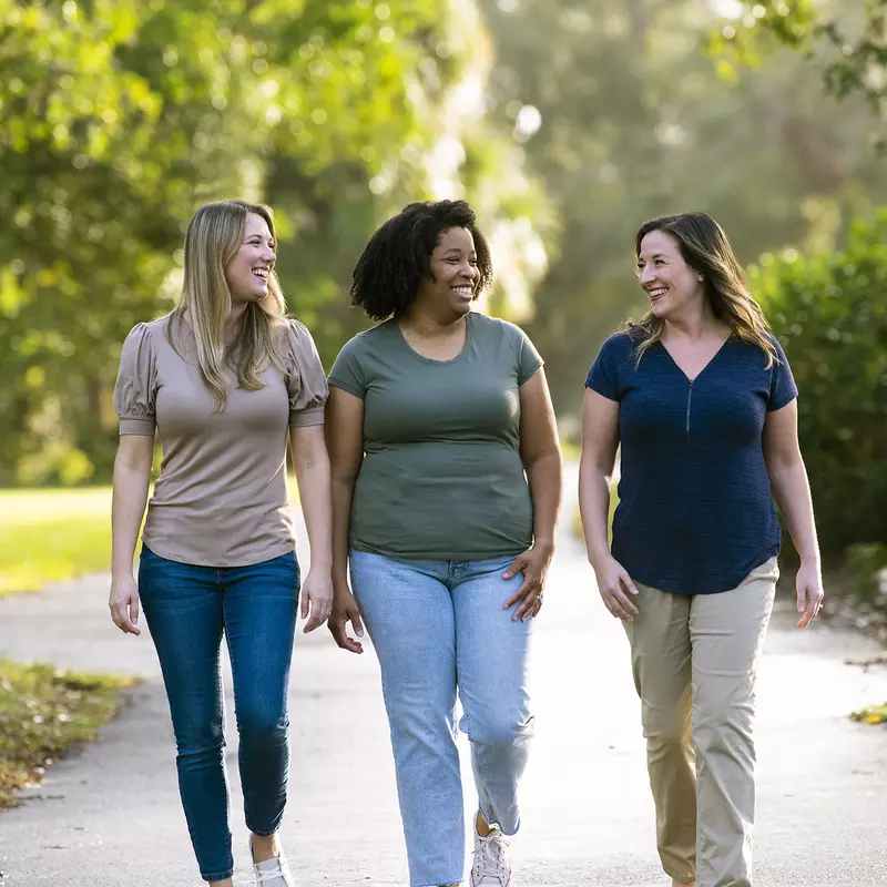 Three women walking outdoors