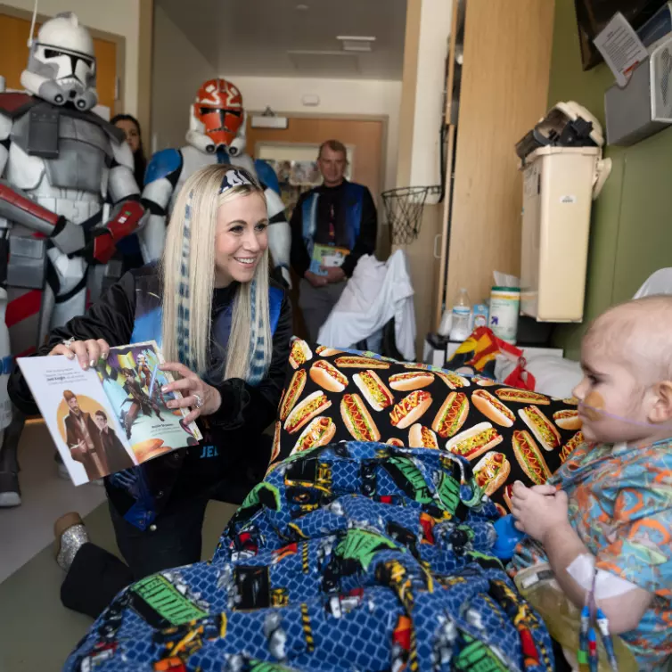 Ashley Eckstein, voice of voice of Star Wars’ Ahsoka Tano, read to a patient at AdventHealth for Children.