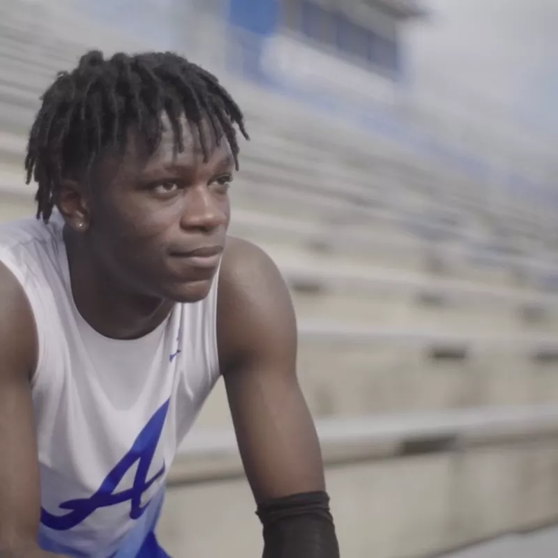 Antonio Parker sits in a stadium