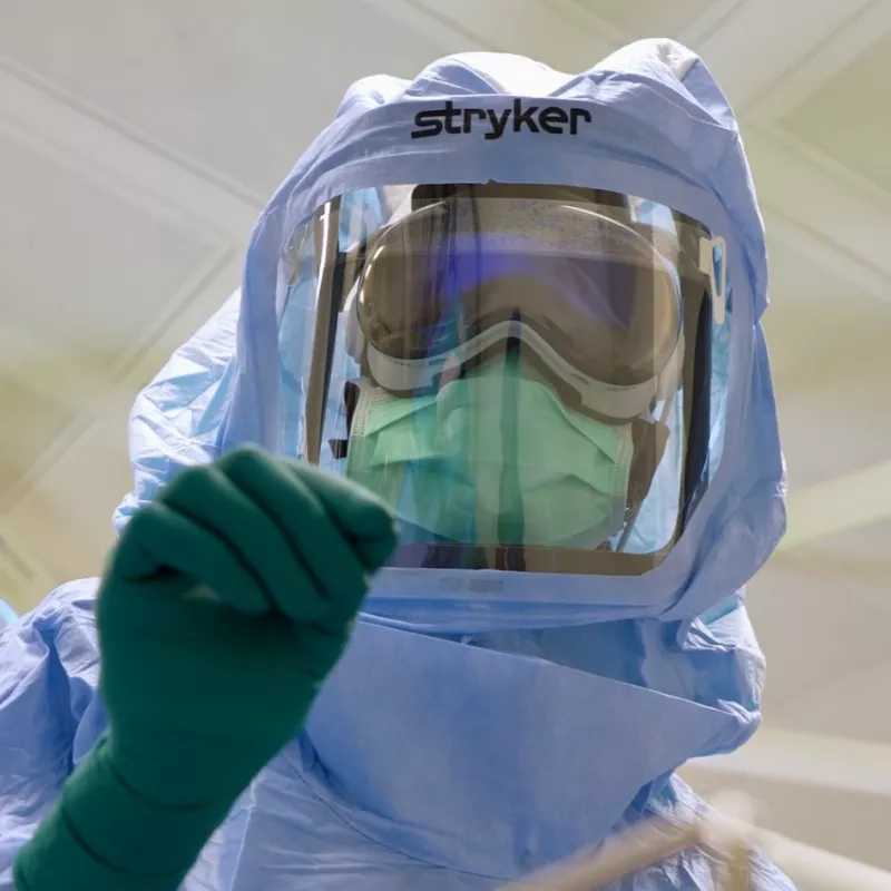 AdventHealth surgical tech, Natasha Francois, dons sterile suit and uses innovative Apple Vision Pro based surgical assist system